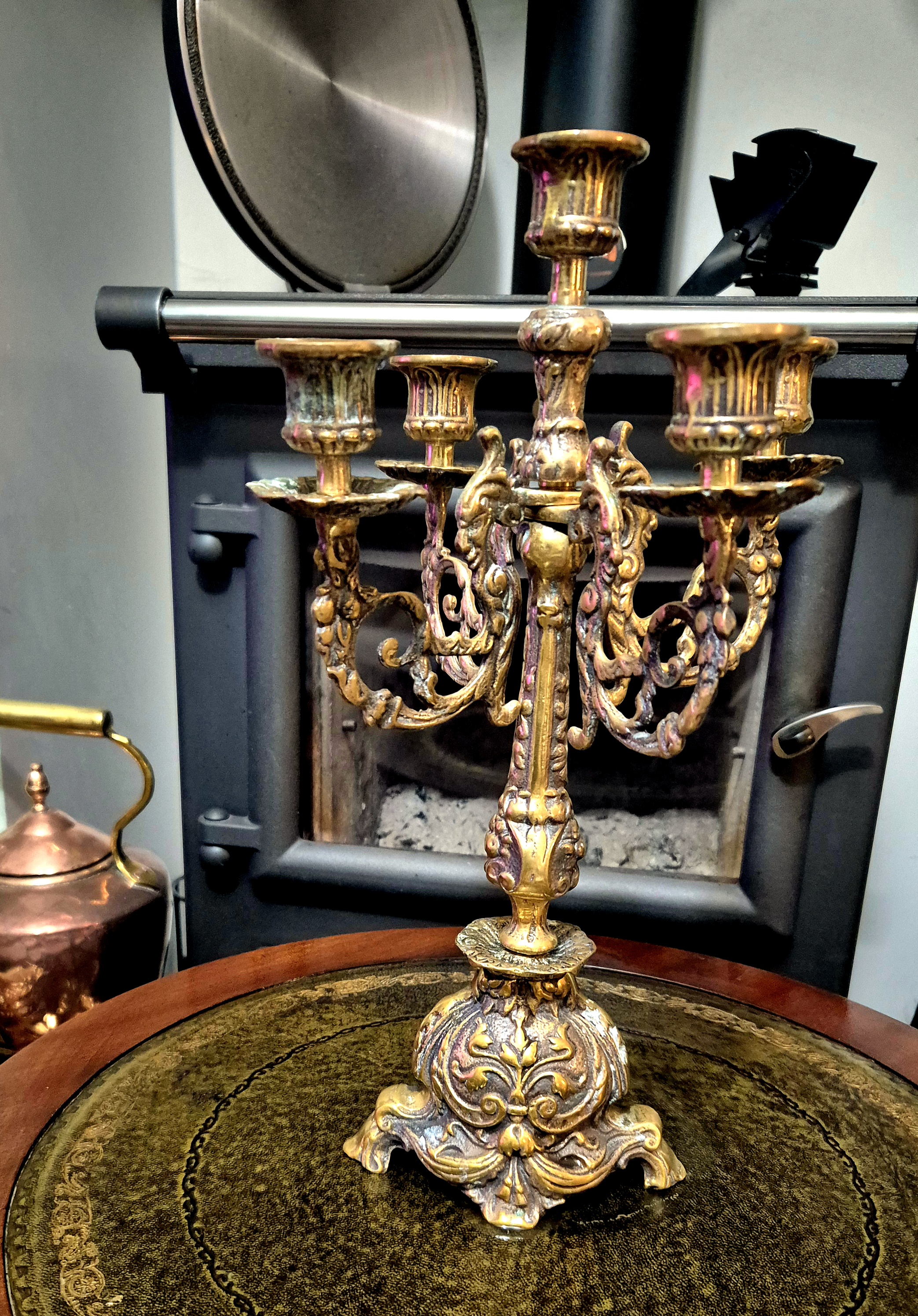 Antique brass candelabra with 5 stems, featuring an ornate r