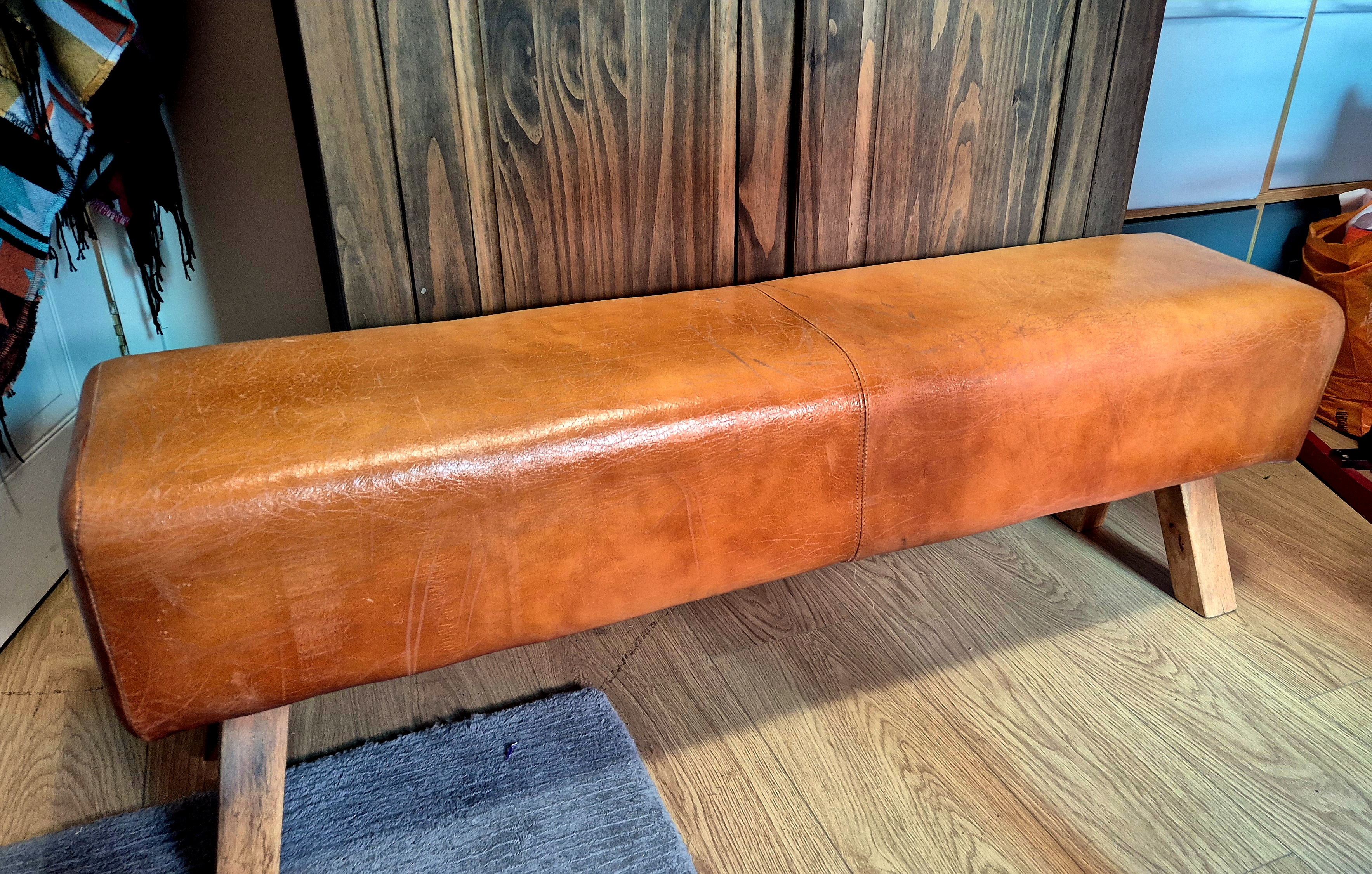 Lovely leather fireside bench approximately 4 to 5 feet long